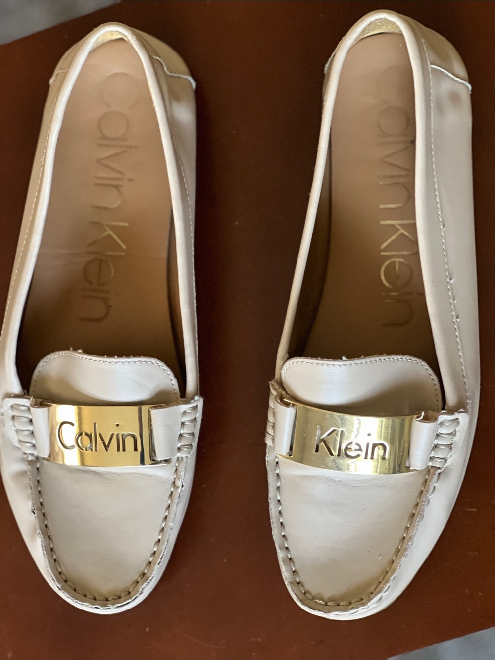 Calvin Klein Cream Leather Slip-On Loafers with Gold Plaque